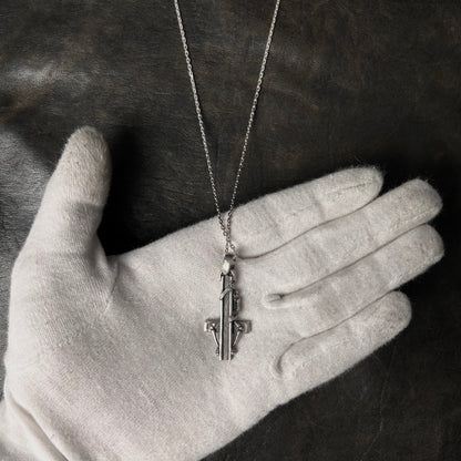 Cross Hugging Skeleton Pendant