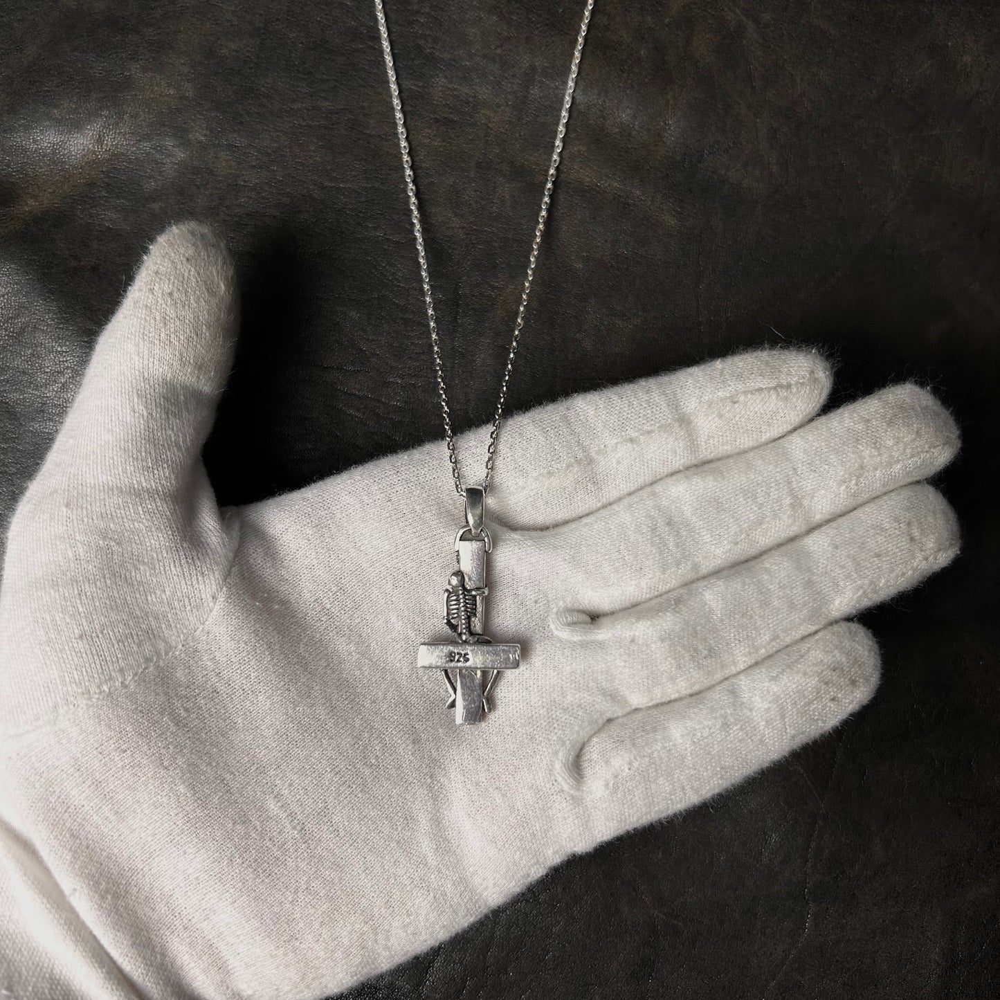 Cross Hugging Skeleton Pendant